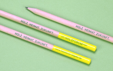 round natural pencil with long yellow lacquered cap