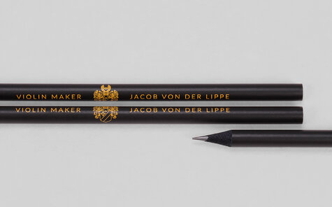 Black matt pencil with detailed printing motif in yellow